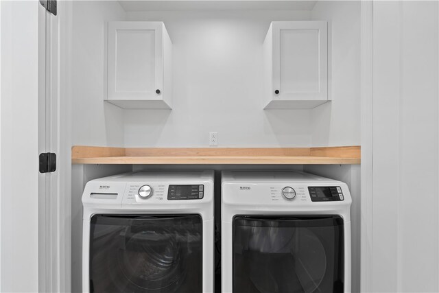 laundry area featuring washing machine and dryer