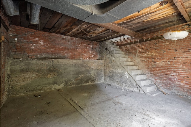 basement with brick wall