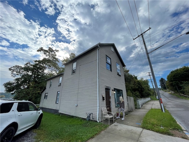 view of home's exterior featuring a yard