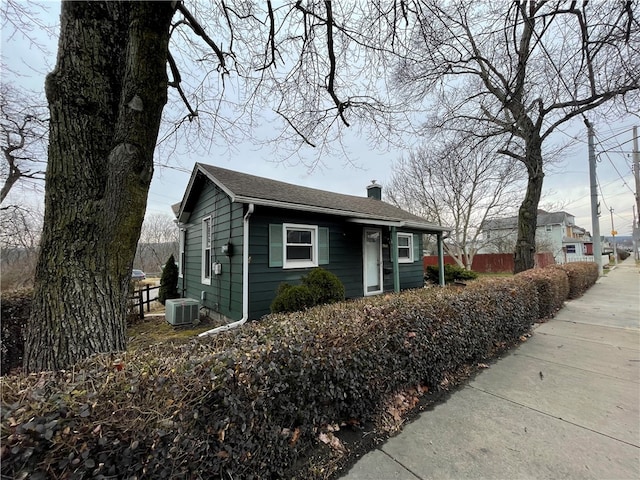 view of side of home featuring central AC unit