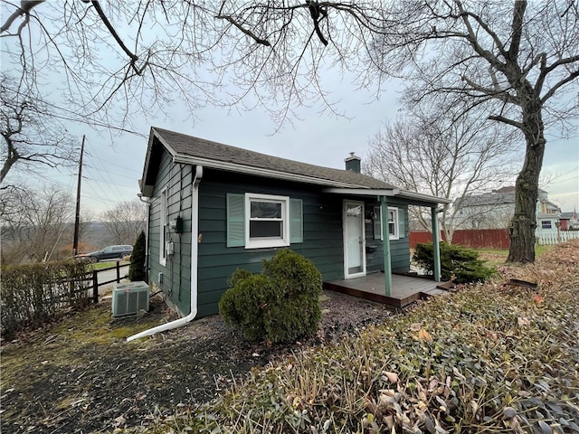 view of front of property featuring cooling unit and a deck