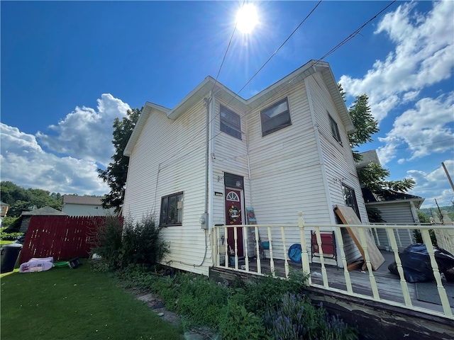 back of house with a wooden deck