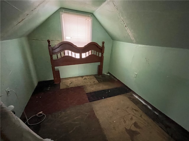 bedroom with lofted ceiling