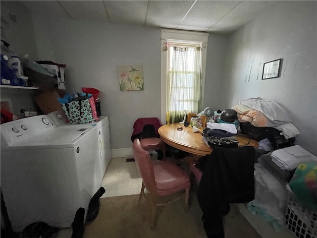 clothes washing area with washer and clothes dryer