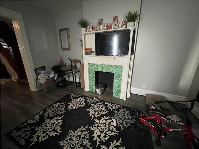 living room featuring a fireplace and dark hardwood / wood-style flooring