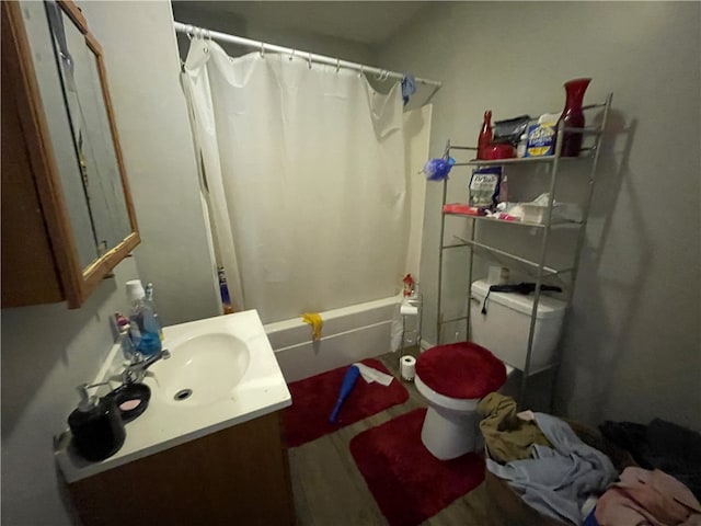 full bathroom featuring vanity, shower / tub combo, and toilet