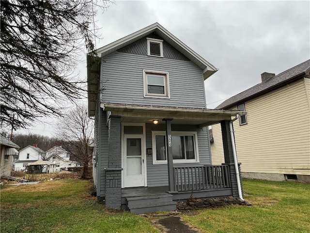 view of front of home featuring a porch and a front yard