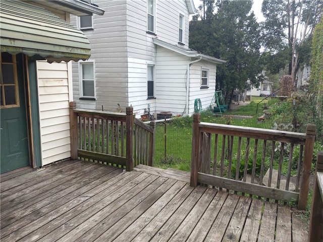 wooden deck featuring a yard