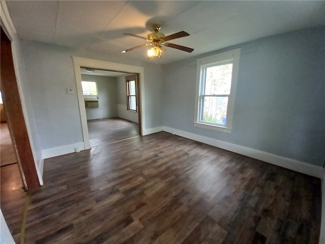 spare room with ceiling fan and dark hardwood / wood-style flooring