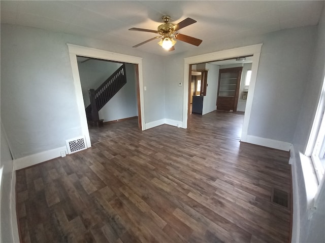 unfurnished room featuring ceiling fan and dark hardwood / wood-style floors