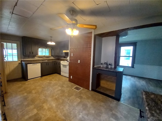 kitchen featuring ceiling fan, sink, and white appliances