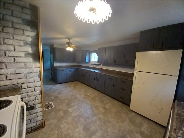 kitchen with white appliances, ceiling fan, and light colored carpet