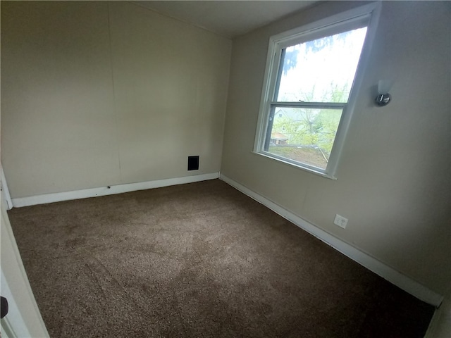 unfurnished room featuring carpet flooring