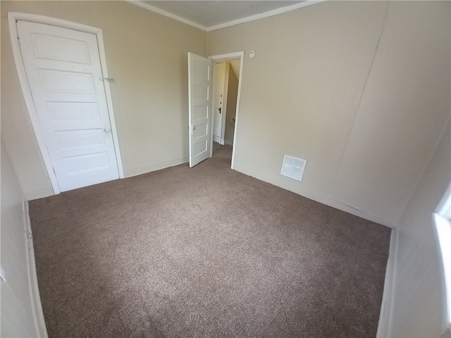 spare room with carpet floors