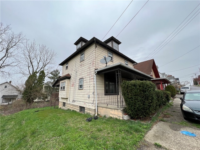 view of property exterior featuring a yard