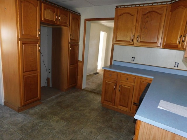 kitchen featuring dark tile floors