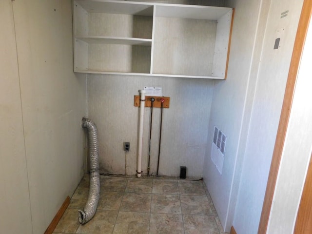 laundry room featuring light tile floors and hookup for a washing machine