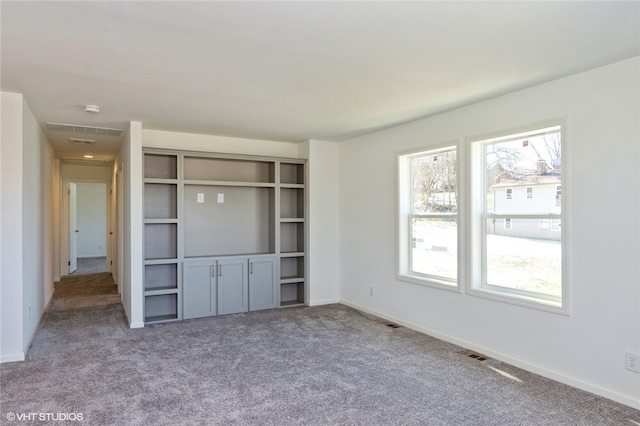 unfurnished bedroom featuring light carpet