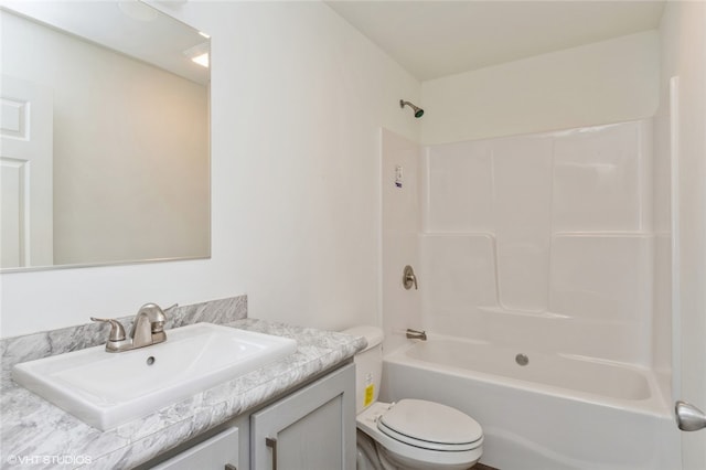 full bathroom featuring vanity, toilet, and  shower combination