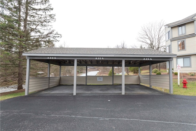 view of vehicle parking with a carport