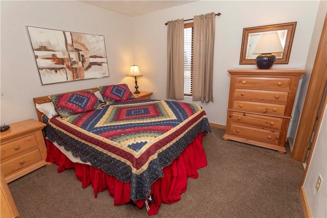 bedroom with dark carpet