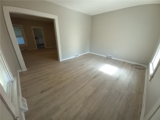 empty room featuring wood-type flooring