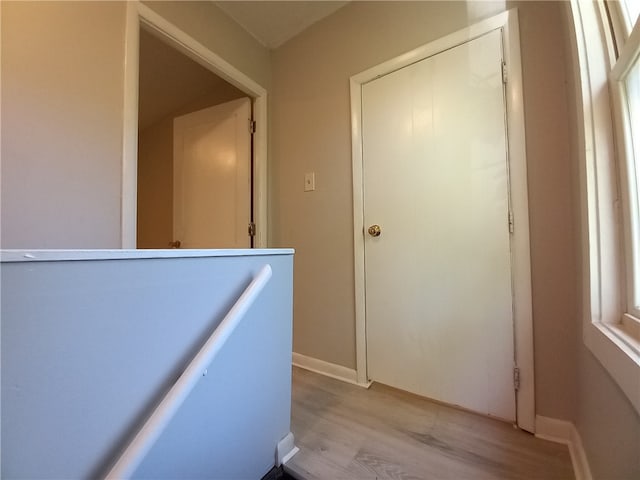 corridor featuring light hardwood / wood-style flooring