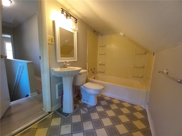 bathroom featuring toilet and bathing tub / shower combination