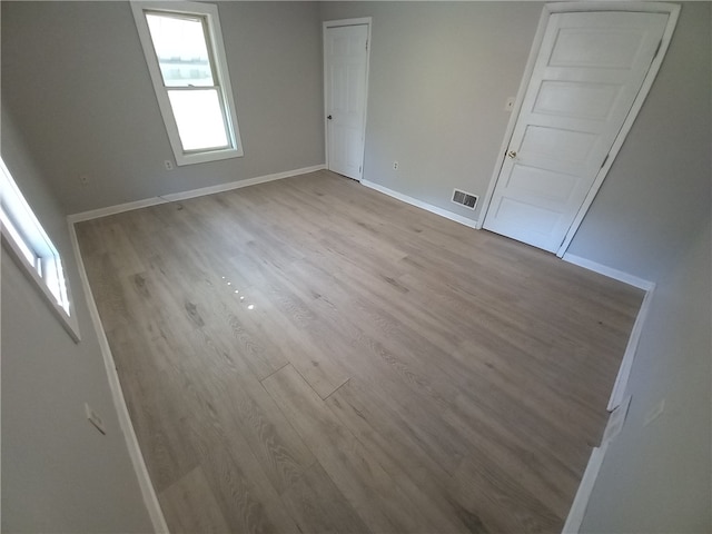 empty room featuring light hardwood / wood-style floors