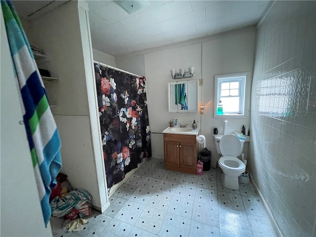 bathroom with vanity, a shower with curtain, and toilet