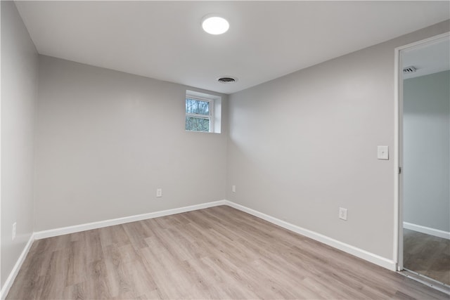 spare room with light hardwood / wood-style flooring