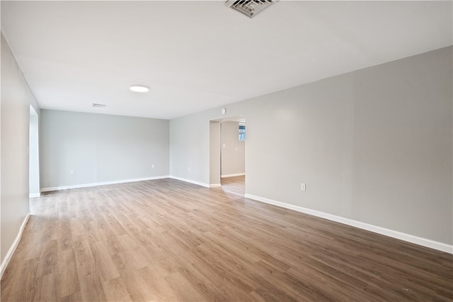 unfurnished room featuring light hardwood / wood-style floors