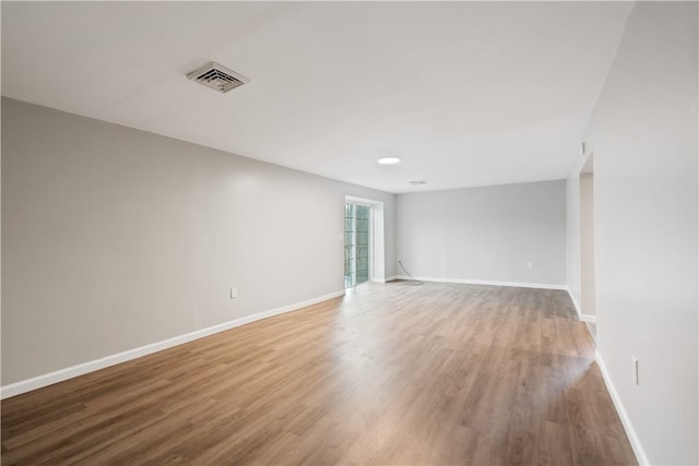 empty room with wood-type flooring