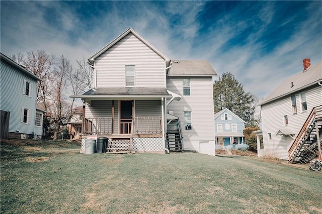 back of property with a lawn