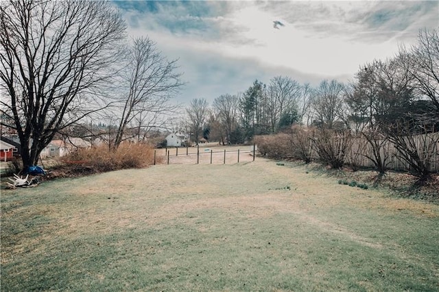 view of yard with a rural view