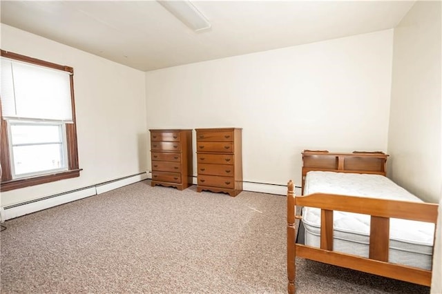 bedroom featuring light carpet and baseboard heating