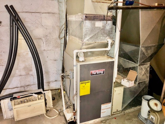 utility room featuring heating utilities