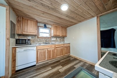 kitchen featuring tasteful backsplash, dark hardwood / wood-style flooring, wooden ceiling, and dishwasher