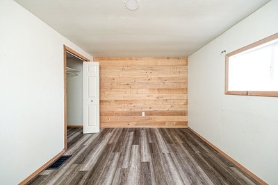 spare room with dark hardwood / wood-style floors