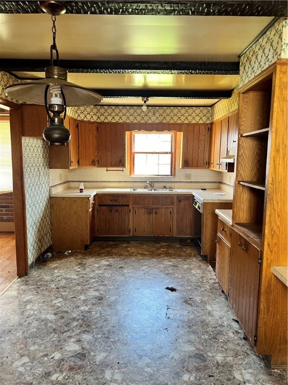 kitchen featuring backsplash and sink