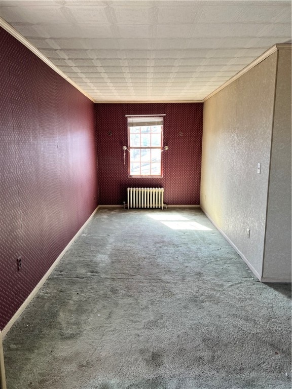 empty room featuring carpet flooring, radiator, and ornamental molding