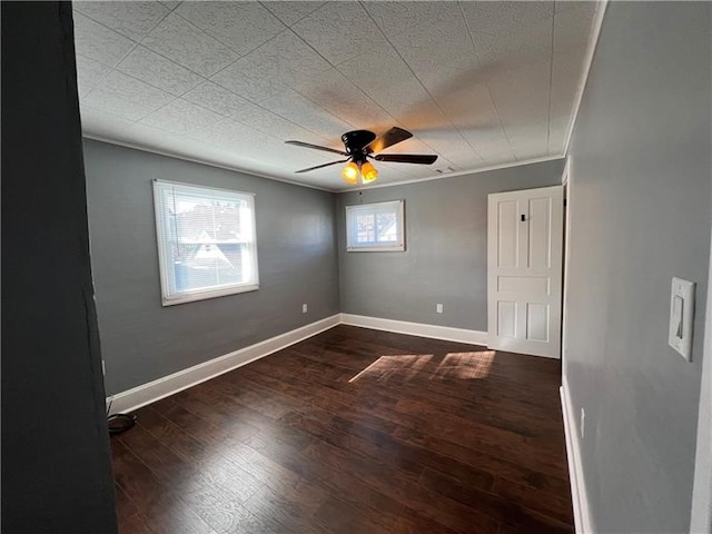 unfurnished room with hardwood / wood-style flooring, crown molding, and ceiling fan