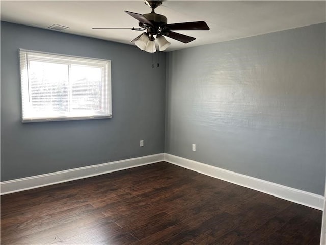 empty room featuring wood-type flooring and ceiling fan