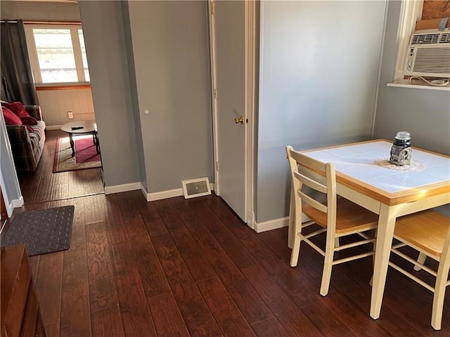 dining space featuring dark hardwood / wood-style floors