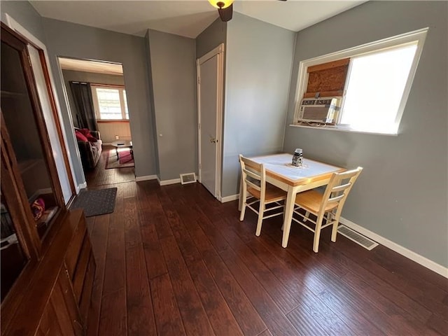 dining space featuring dark hardwood / wood-style flooring and ceiling fan