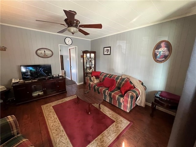 living room with ornamental molding, ceiling fan, and dark hardwood / wood-style floors