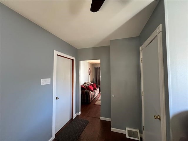 corridor featuring dark hardwood / wood-style flooring