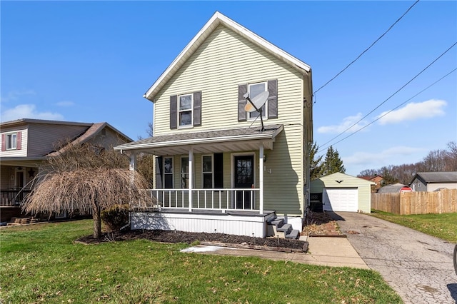 view of front property featuring a front lawn, covered porch, and a garage