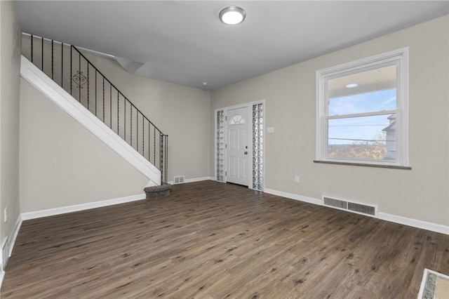 foyer with dark hardwood / wood-style flooring