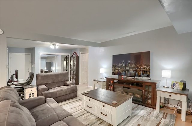 living room with light hardwood / wood-style flooring